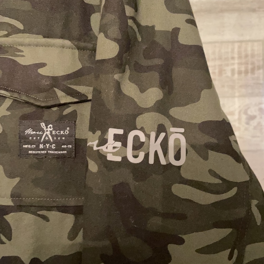 Camouflage green and black overcoat by Marc Ecko